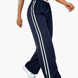 Pantalon large sport femme style streetwear à bandes – coupe décontractée idéale pour le quotidien