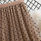 Jupe midi élégante à pois pour femme, style évasé chic, idéale pour le printemps et l'été