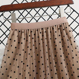 Jupe midi élégante à pois pour femme, style évasé chic, idéale pour le printemps et l'été