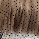 Jupe midi élégante à pois pour femme, style évasé chic, idéale pour le printemps et l'été